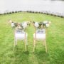 Chairs decorated for a wedding ceremony