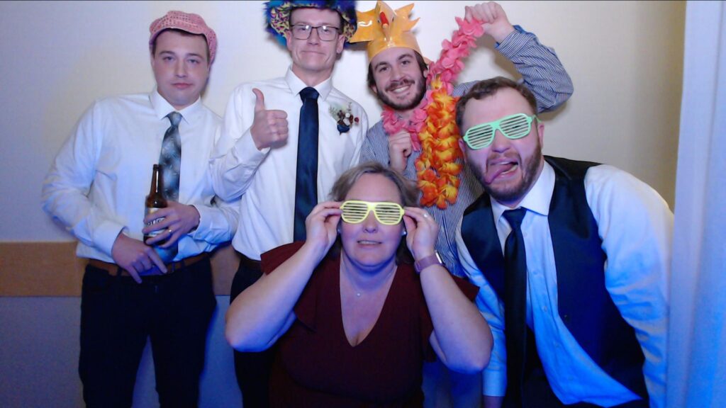 Group of people celebrating together. Photo booth rental