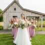 Bridal party in front of barn.