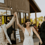 Couple celebrating at outdoor wedding.