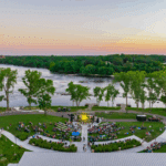 Outdoor concert by the river at sunset