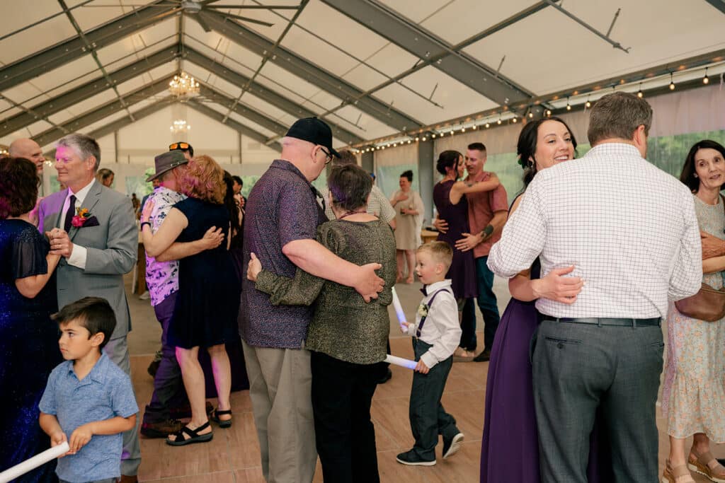 Guests enjoying personalized wedding song requests at a reception