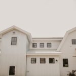 Modern white barn-style building exterior