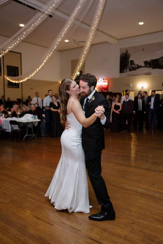 Couple dancing at a formal event.