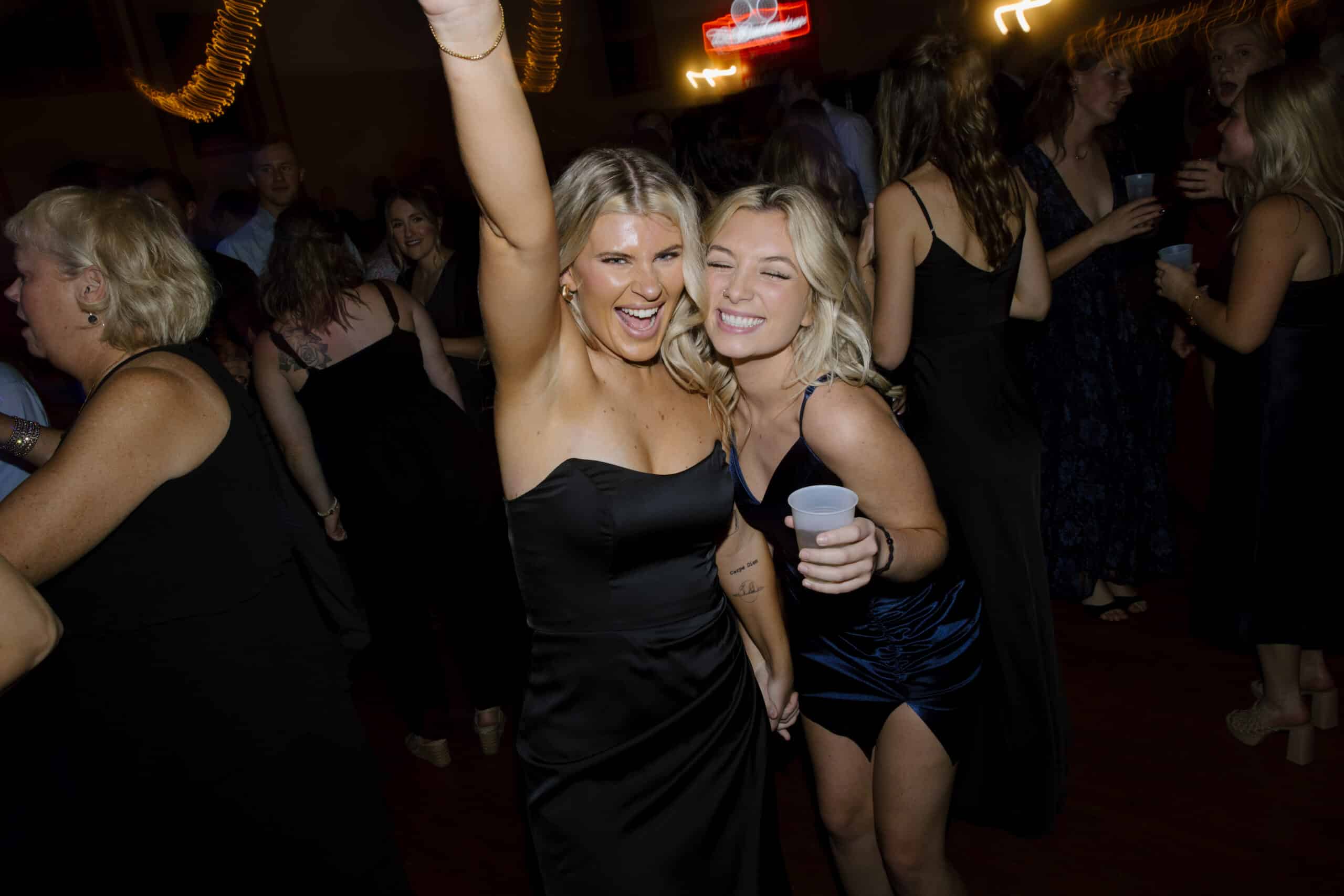 Women dancing at a party.