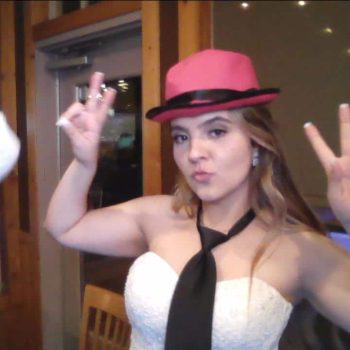Celebratory pose with pink hat