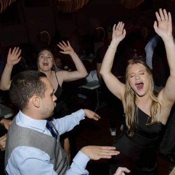 People dancing at a lively event.