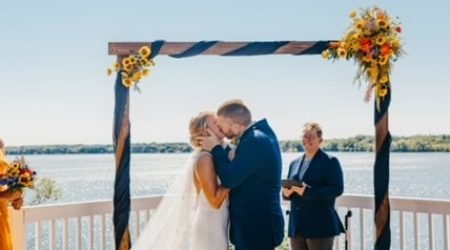 Couple kissing at outdoor wedding