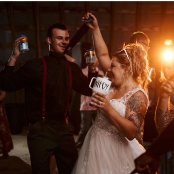 Wedding celebration with dancing guests.
