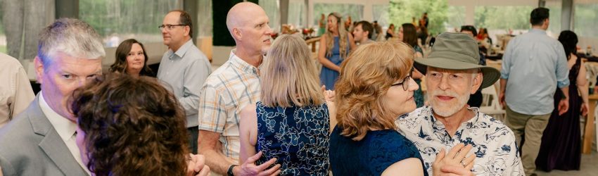 People dancing at a wedding reception.